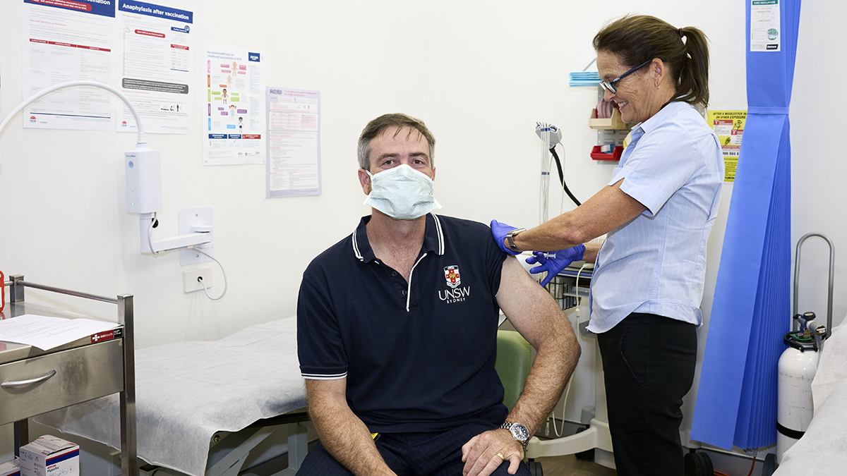 Vice-Chancellor and President Attila Brungs receiving his flu vaccination