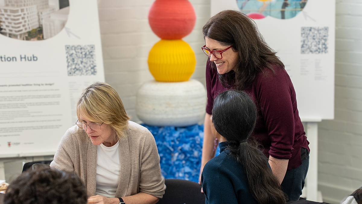 Innovation Hub Director Carly Vickers working with a team