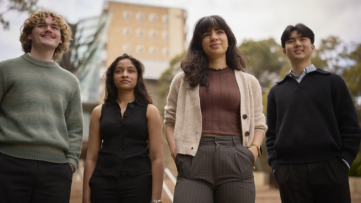 Four students looking into the distance