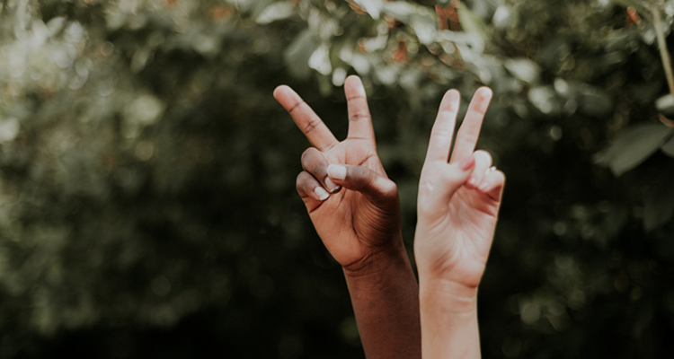 Two hands with peace sign