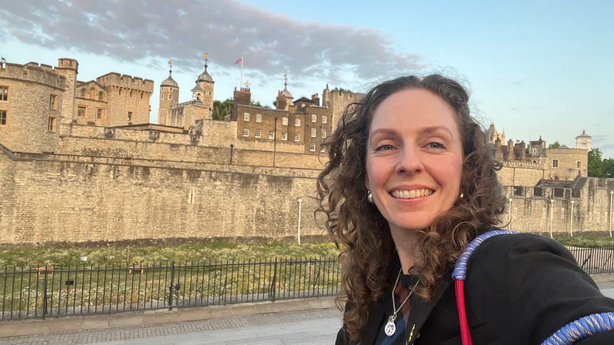 Rebecca Martin standing outside the Tower of London in the UK.
