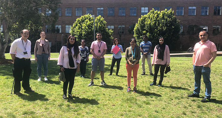 students coming together for breast cancer awareness day