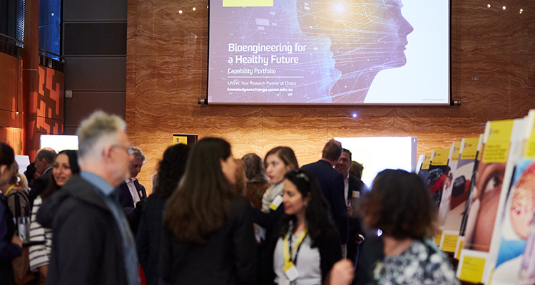 People looking at a screen with the websit on