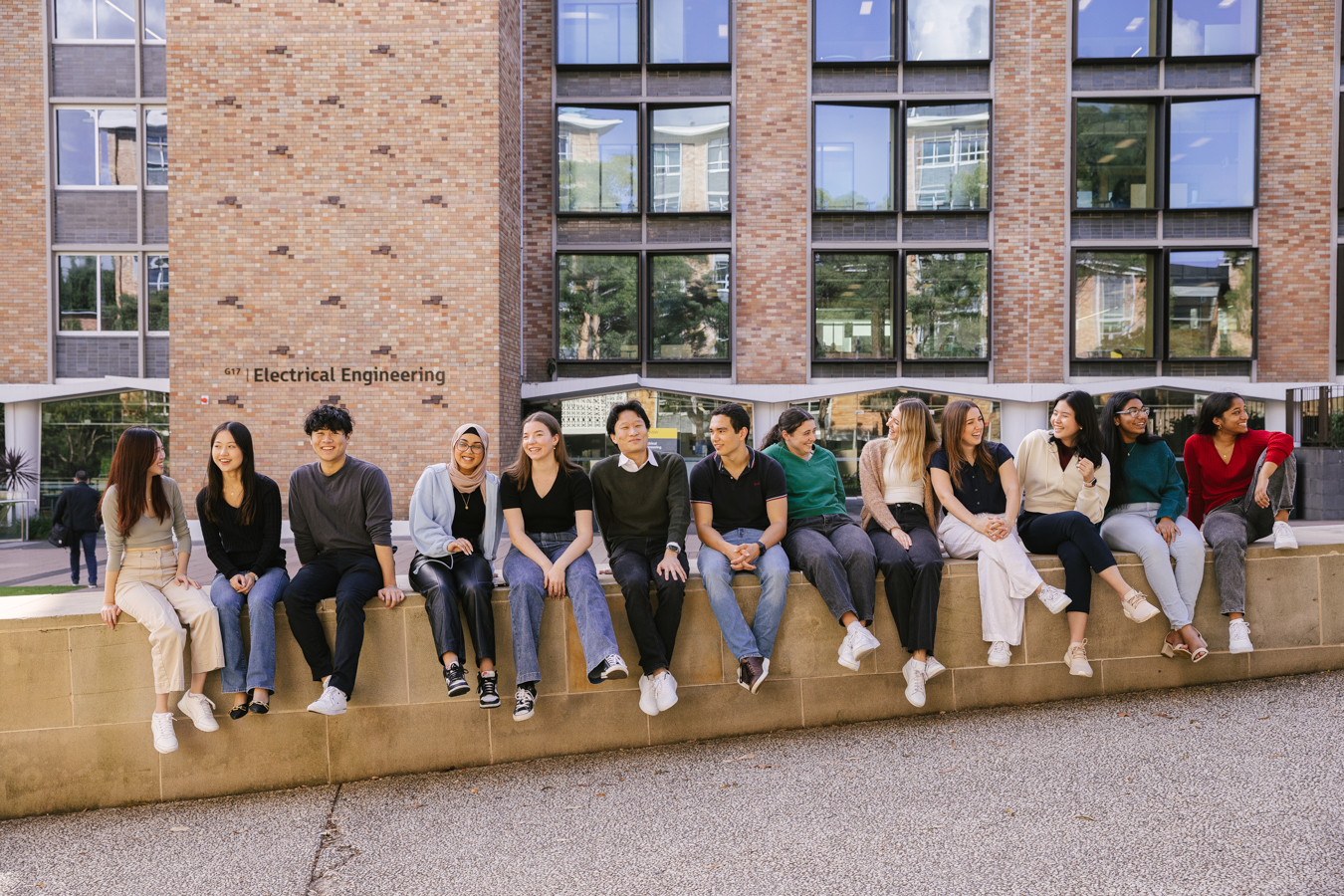 Co-op students sitting outside electrical engineering