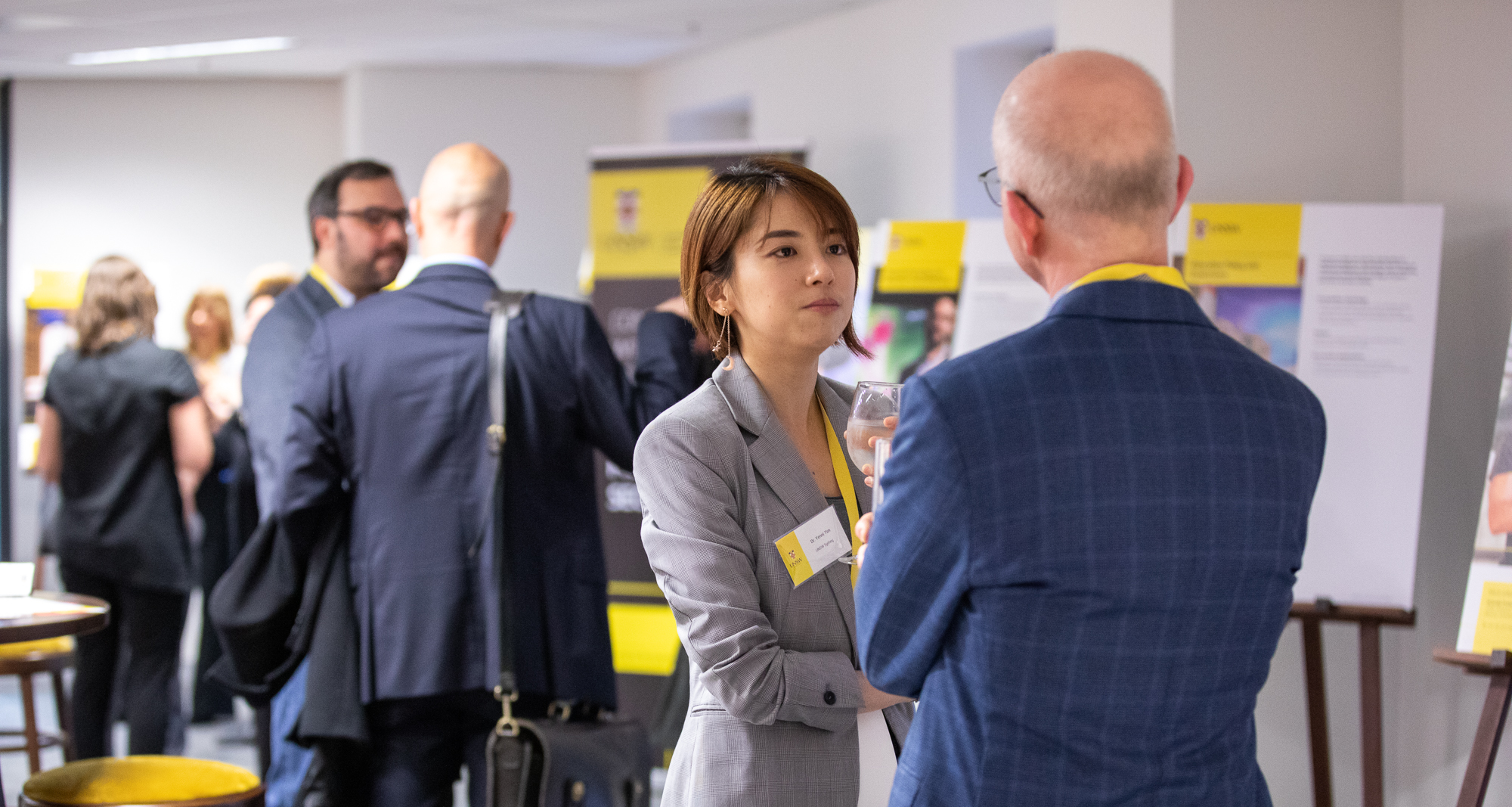 Two people talking at an event