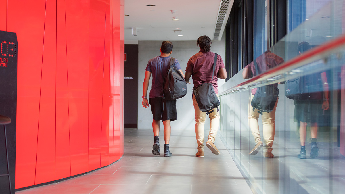 Students walking with their backs turned