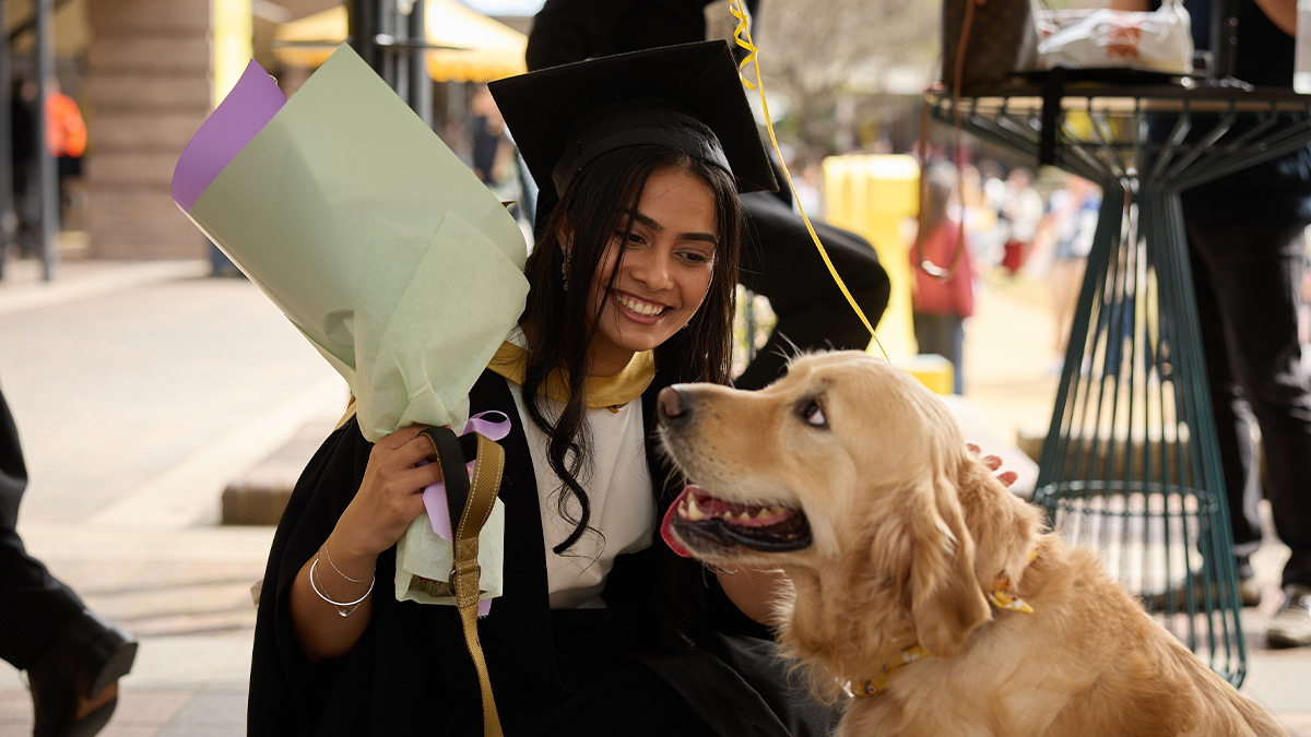 graduate and dog