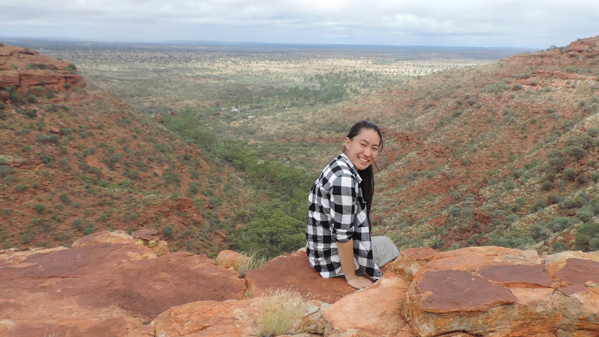 Naomi Huynh sitting on a ledge at King's Canyon
