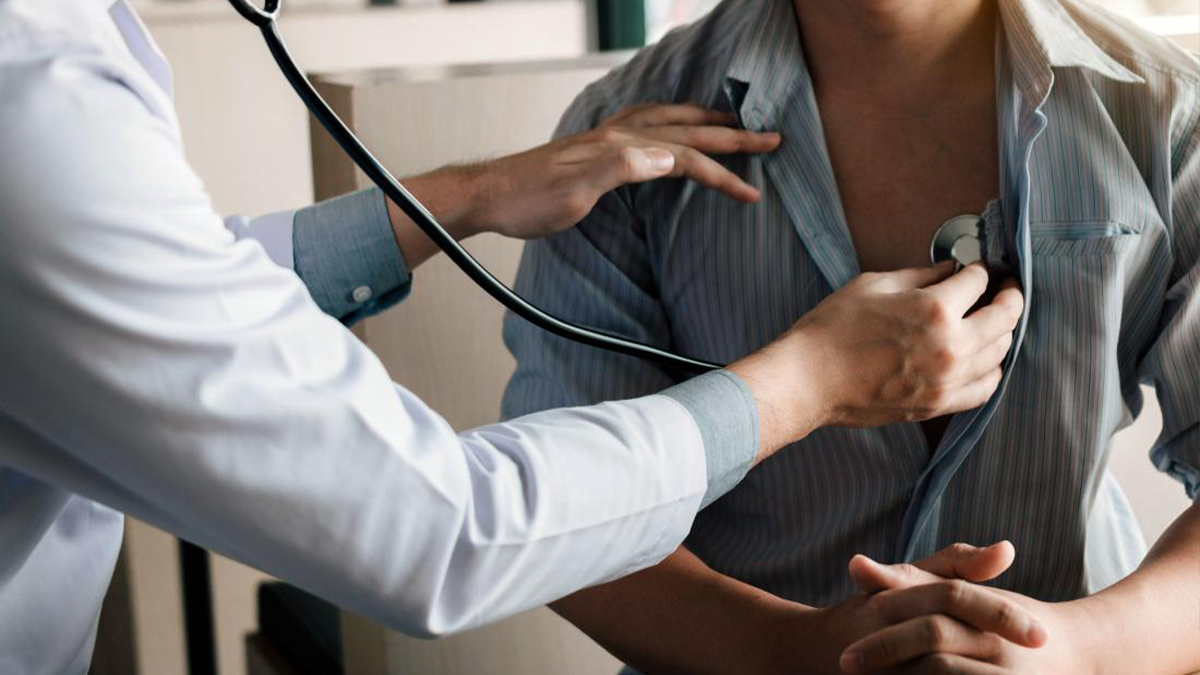 Doctor listening to a patient's heartbeat 