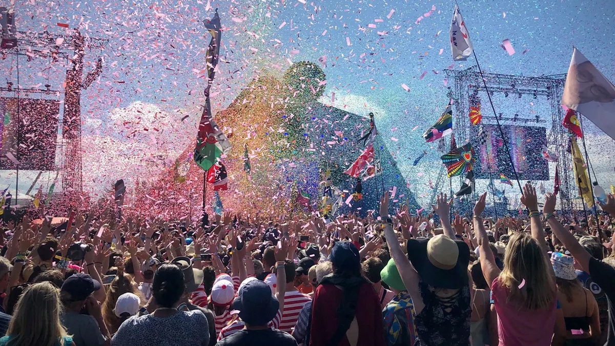 People enjoying a performance at a music festival 