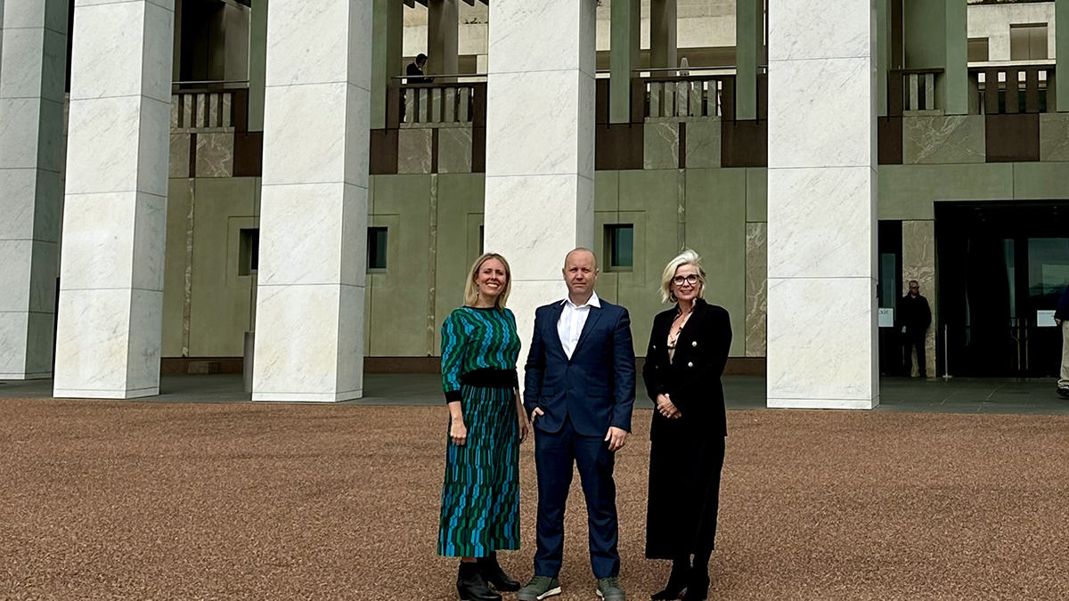 Members of the OCD BOUNCE team standing outside Parliament House in Canberra