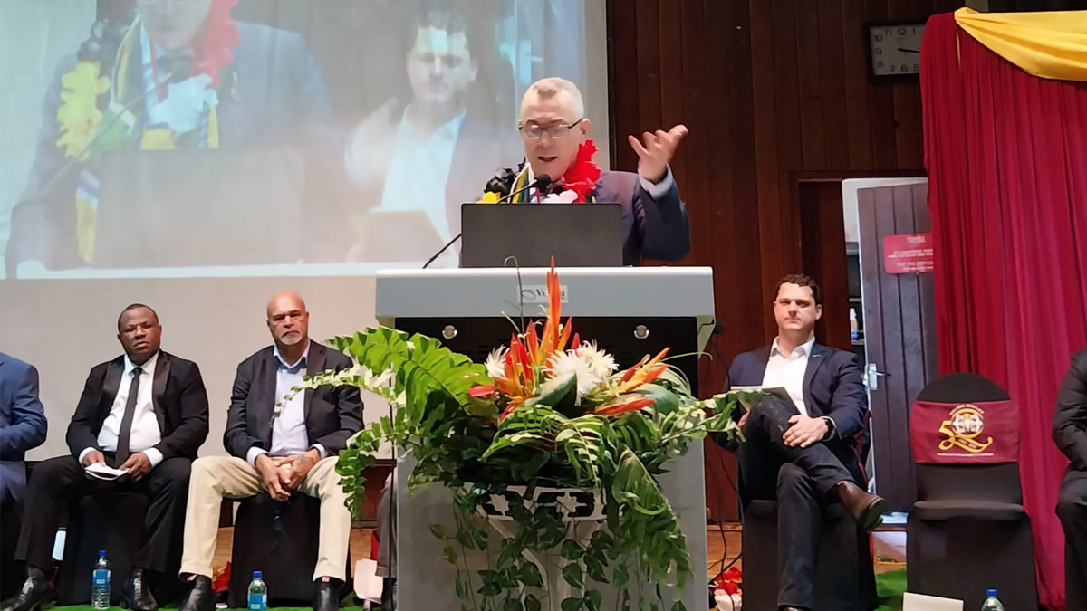 A person speaking at a podium