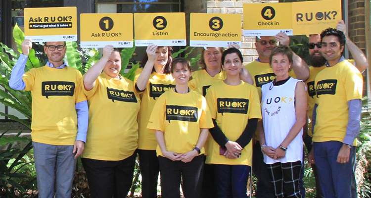 UNSW staff in yellow R U OK Day t-shirts outside the Chancellery