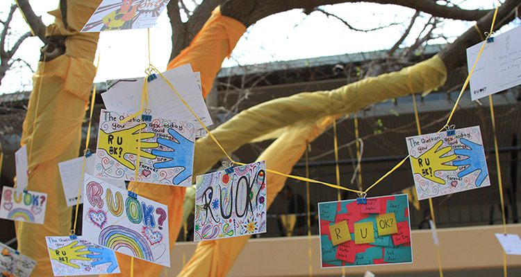 R U OK messages tied to a tree