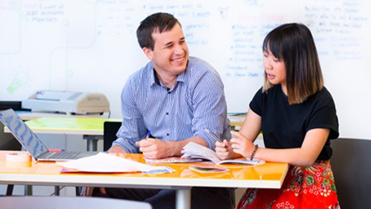 Students sitting together at a table talking