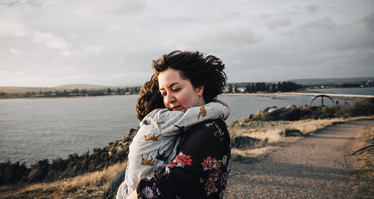 Mother hugging child