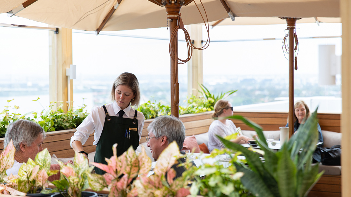 The Lounge terrage with a waitress serving customers