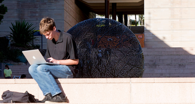 researcher on computer at UNSW