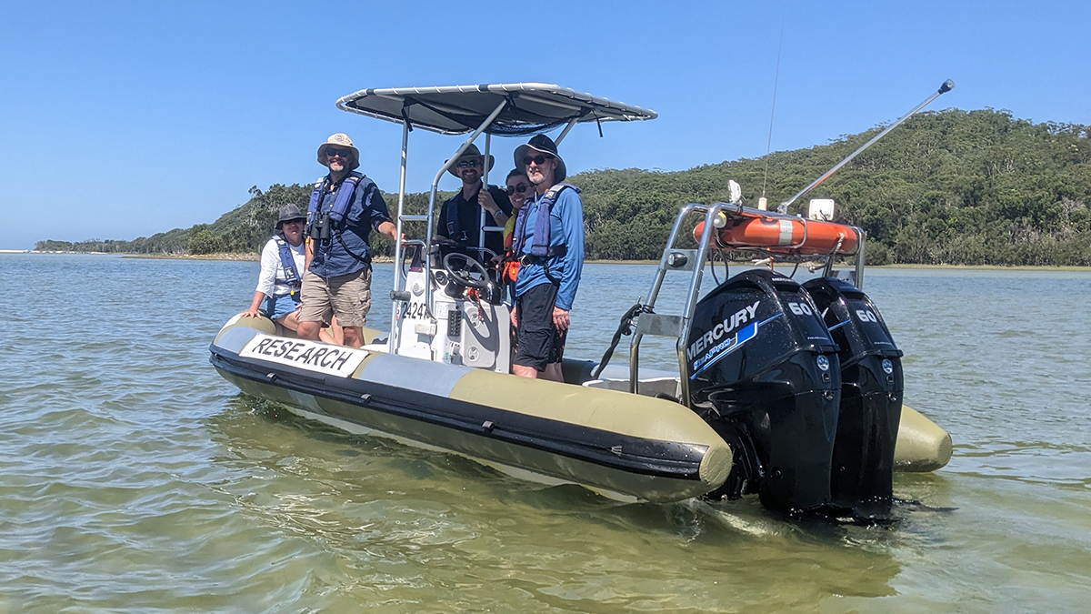 UNSW staff on a boat at Smiths Lake Field Station