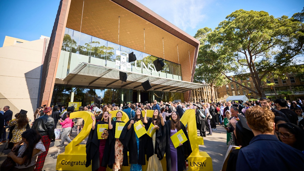 Students and their families celebrate graduations outside the Clancy Auditorium