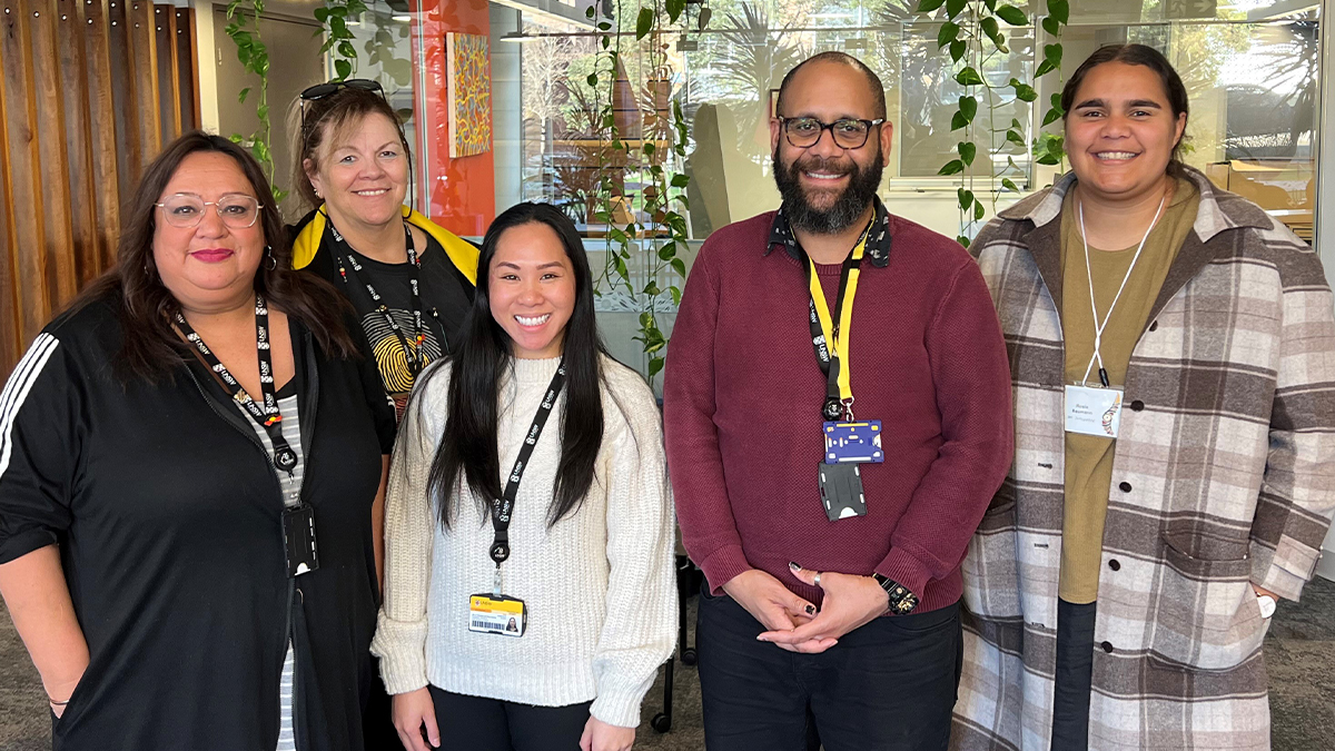 Photograph at Nura Gili, with staff Tanya Griffiths, Lizzy Mayers, Kyla Sumaylo, Quinton Vea Vea and current student, Rosina Baumann