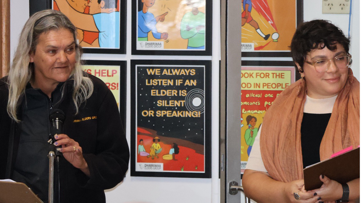 Two people standing and looking to the right - Vanessa Hickey, DEG Community Response Lead, and Peta MacGillivray, UNSW Senior Research Fellow, at the launch of the Galuma-li community hub in Walgett that houses the Youth Wellbeing Service
