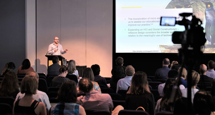 Man presenting to an audience