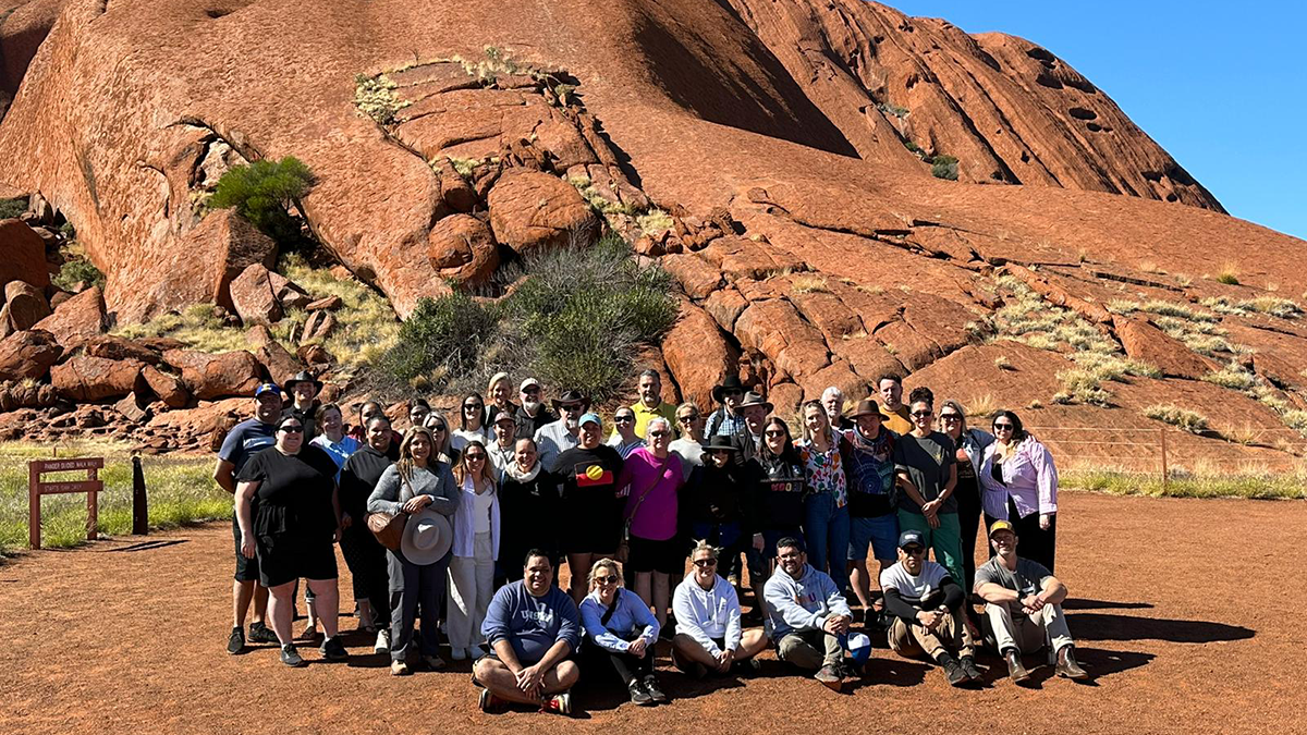 The 2023 EIELP cohort during an on-Country learning experience at Uluru
