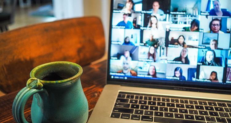 Coffee mug next to laptop Teams meeting