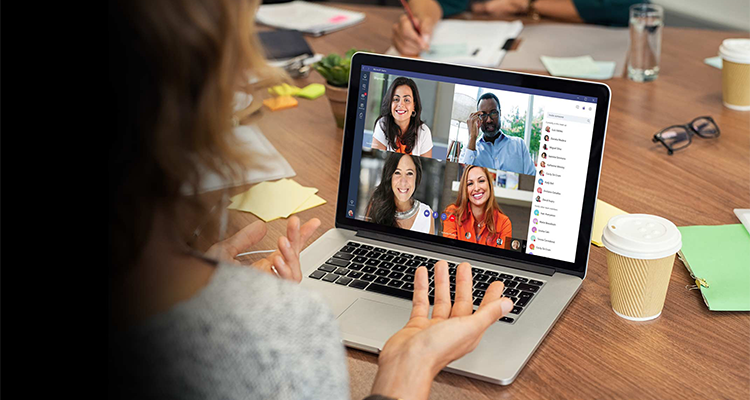 A person holding an online meeting on their laptop