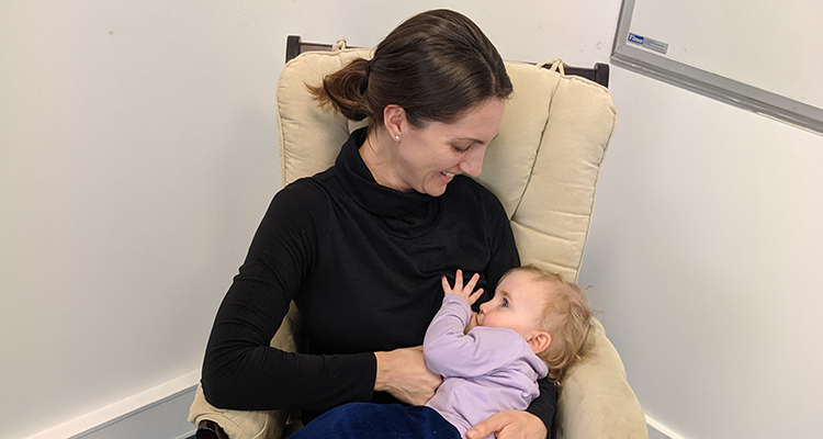 Suzanne Austin feeding her daughter