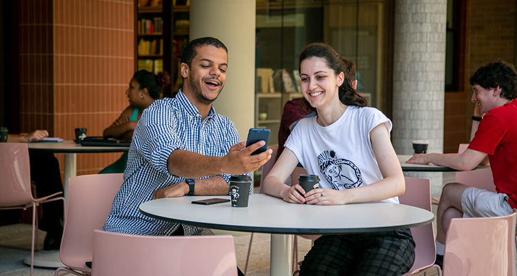 UNSW students enjoying the Uni-verse app at UNSW Bookshop