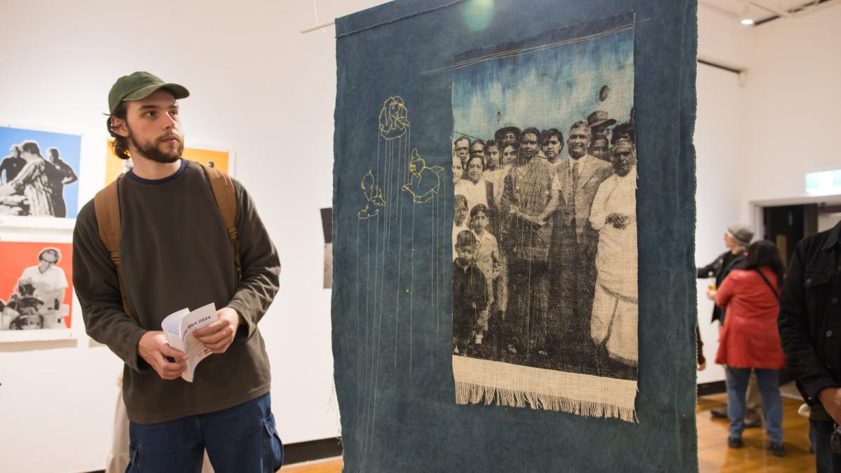 Man looking at artwork