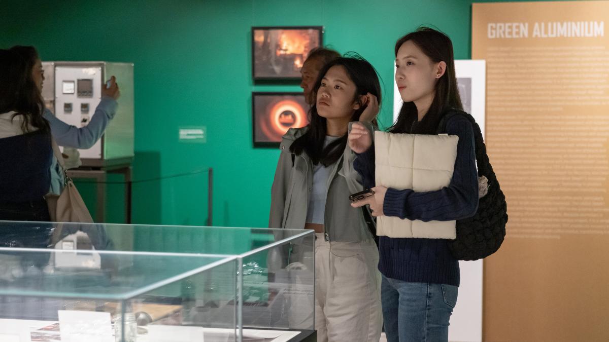 Two people looking at a museum display