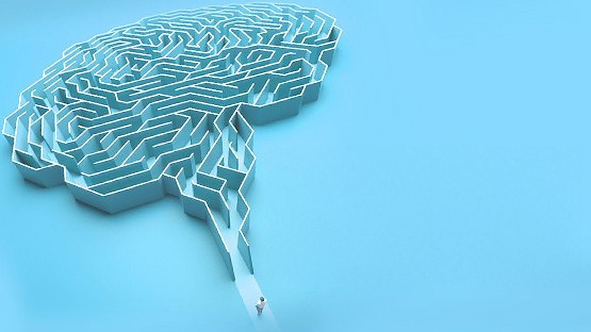 A brain formed of a maze on a blue background