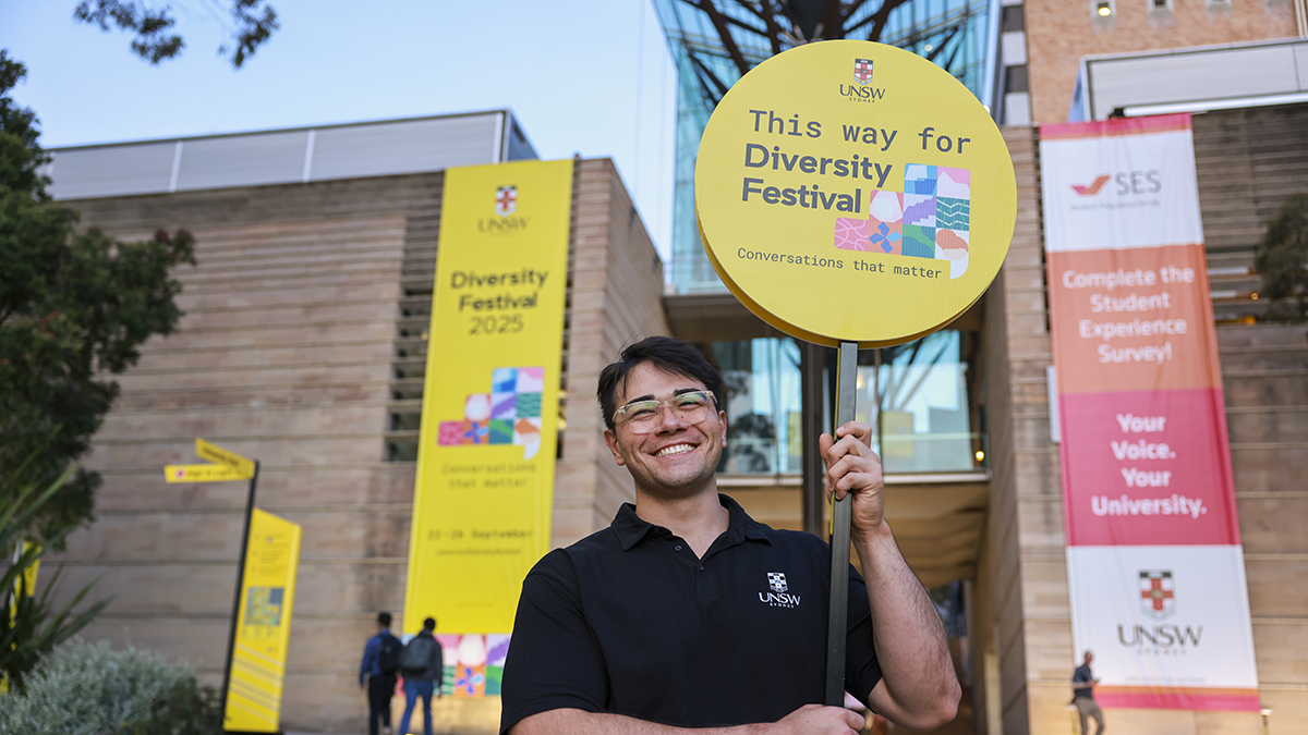 Person holding a sign for Diversity Festival