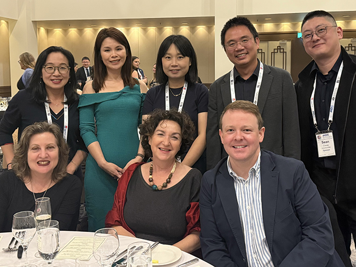 Alisa Tian with a group of colleagues at an event