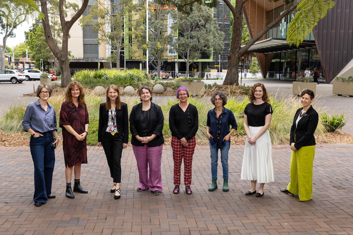 Members of the UNSW Athena Swan Self-Assessment Team standing near the Clancy Auditorium