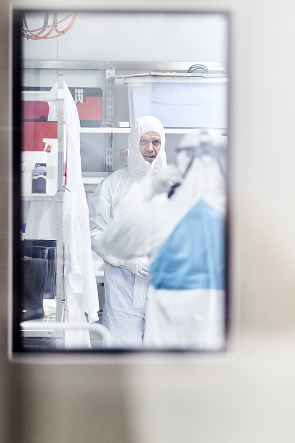 Stuart Turville and Alberto Ospina Stella preparing to enter the Kirby Institute PC3 containment lab 