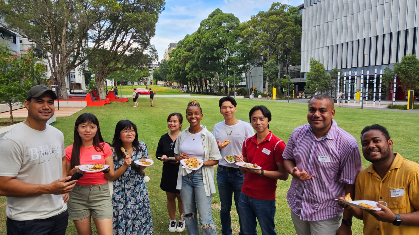 A group of students standing on the lawn at UNSW