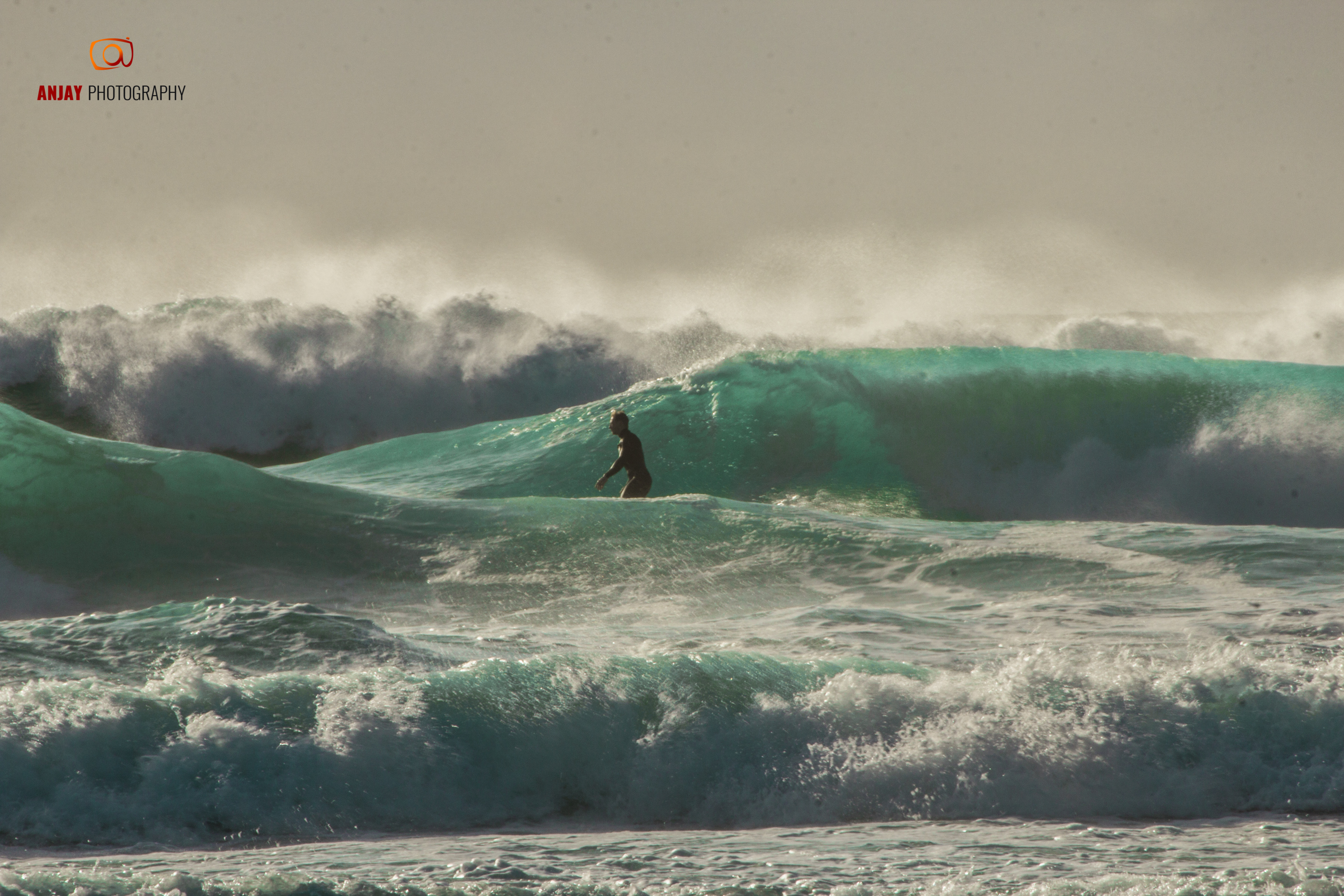 A man surfing.