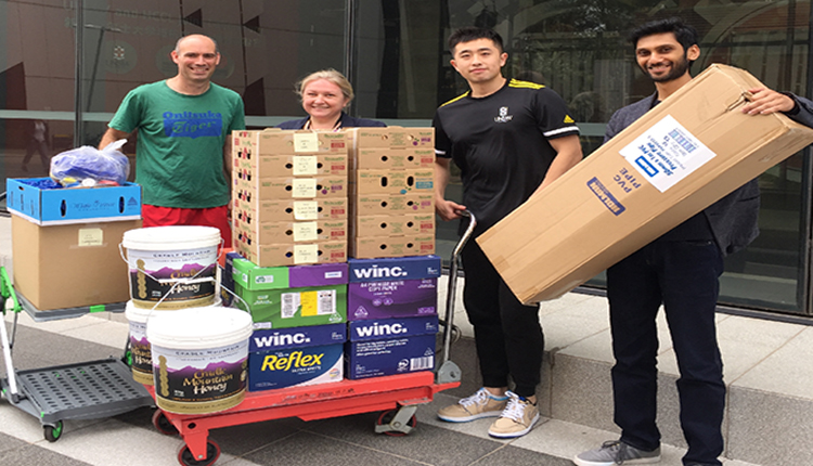 Paul Sheehy and Marina Yastreboff from UNSW Legal Office, Anirban Ghose and Dingren (Clay) Zhou from the SMaRT Centre can be seen with around 10,000 discarded milk bottle caps