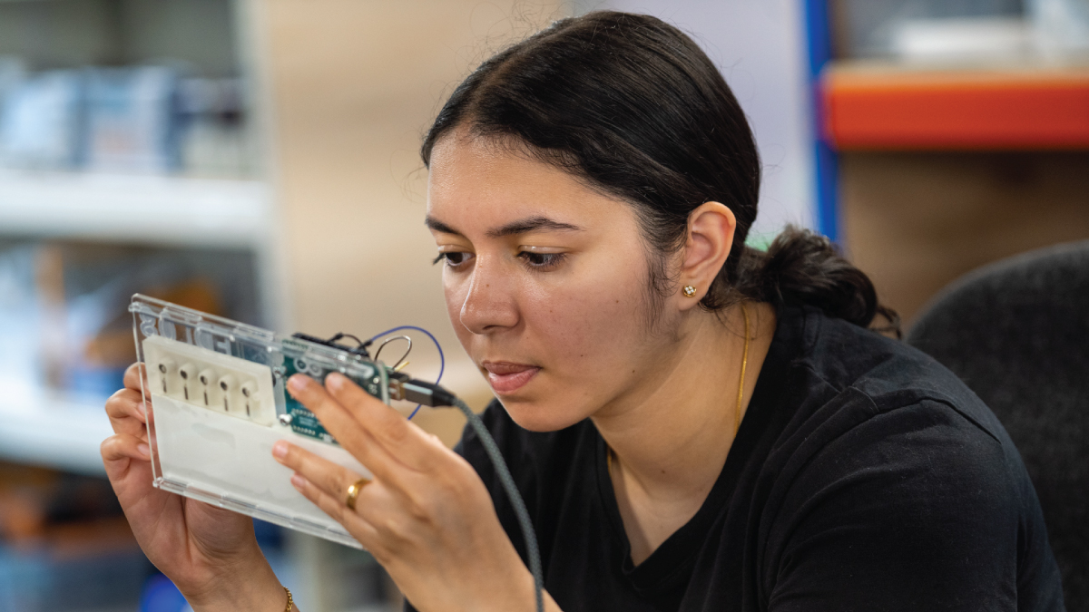 Student working on circuit board