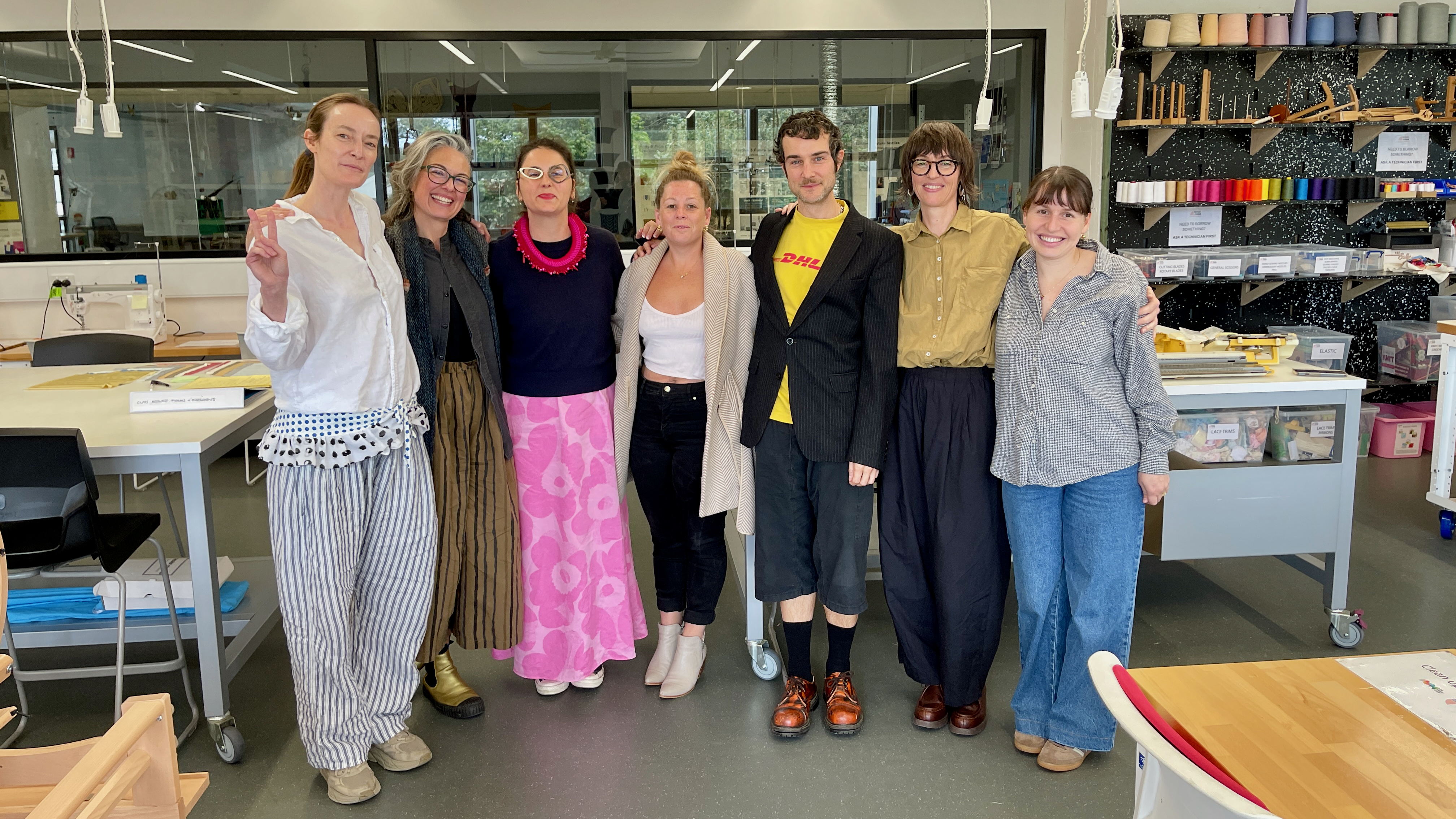 A group of people in a textile studio