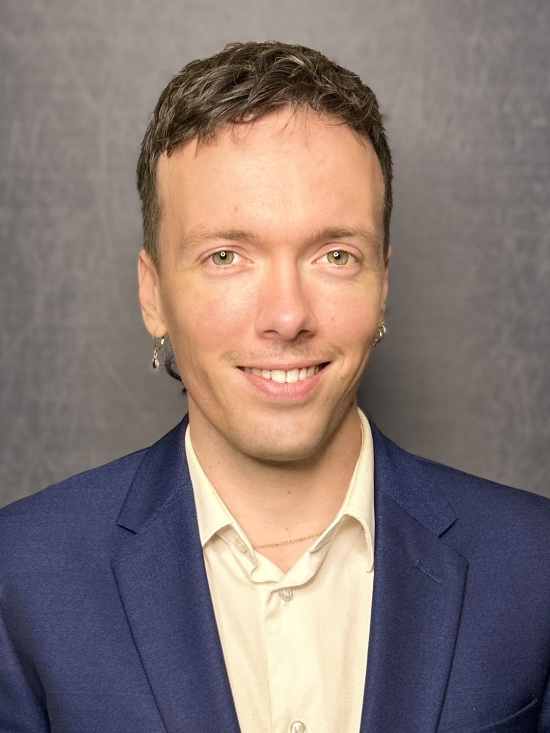A headshot of James Raggatt.