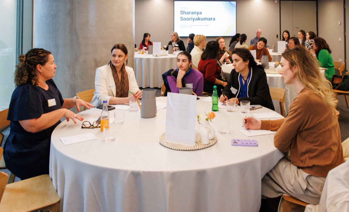A group of people at a table talking