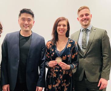 A group of five Architect's Medallion winners, showing two women and three men, with UNSW winner Samantha Rich at the centre