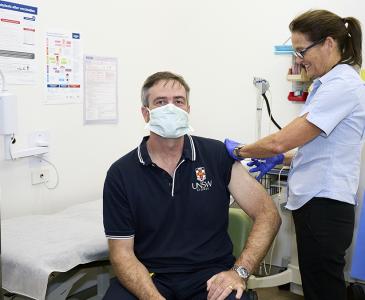 Vice-Chancellor and President Attila Brungs receiving his flu vaccination