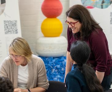 Innovation Hub Director Carly Vickers working with a team