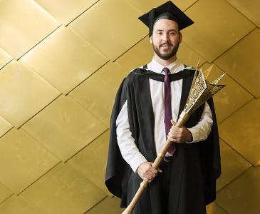 Noah Jugow with the new ceremonial he designed